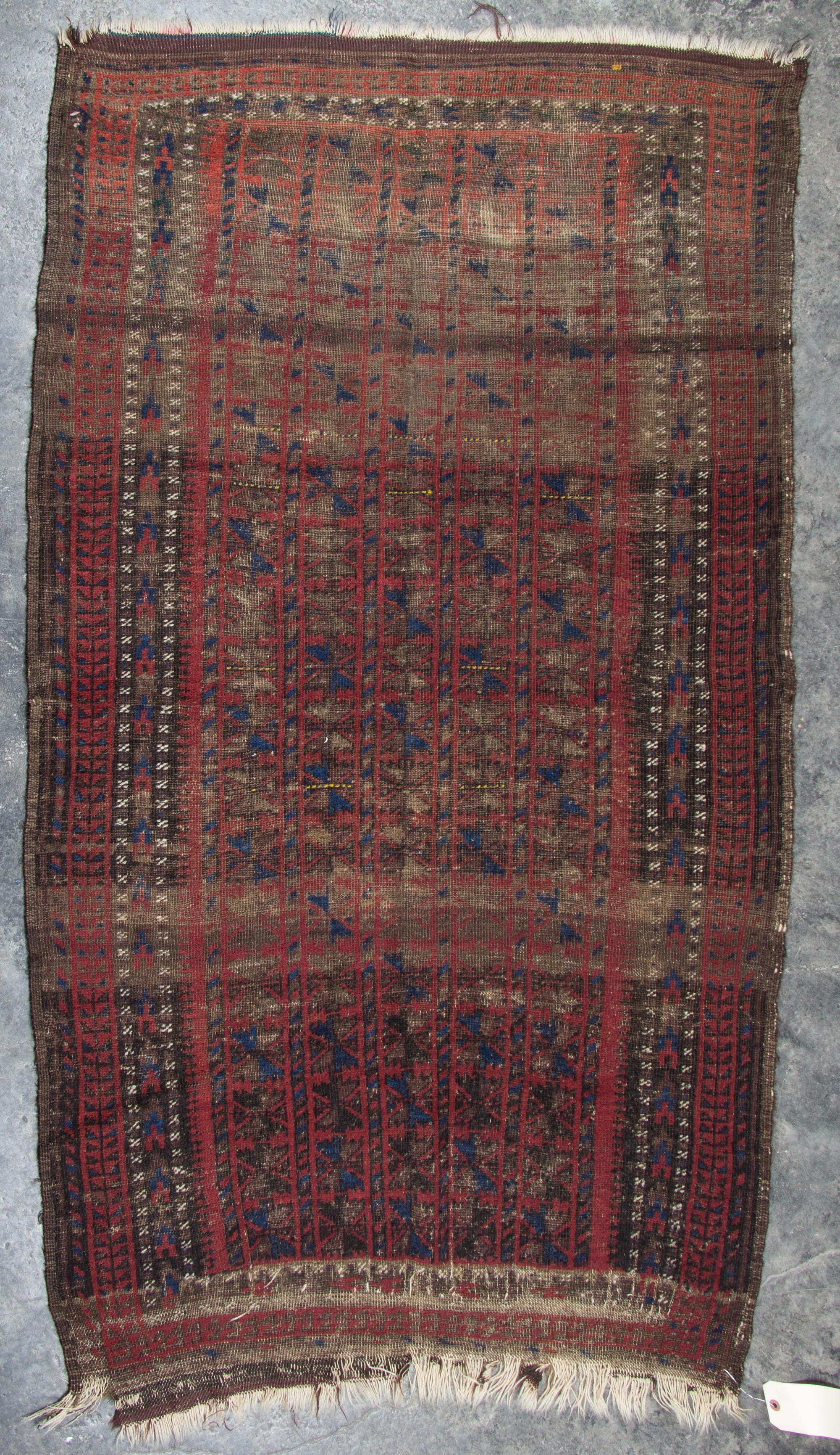 A Group of Three Rugs Largest 5 feet 10 inches x 3 feet 4 inches.