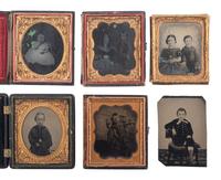 [EARLY PHOTOGRAPHY]. A group of 19 ambrotypes and tintypes of children of varying ages, some posed with their parents, incl. African American infant and pairs of images taken during the same sitting.