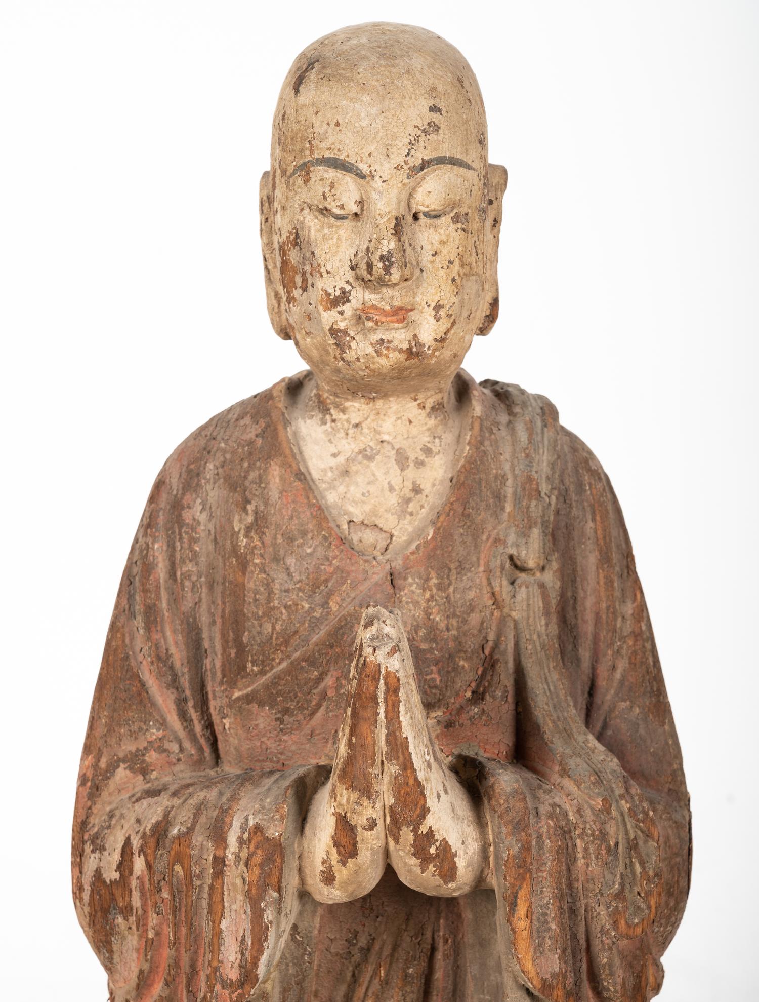A Chinese Carved Wood Standing Figure with Polychrome Decoration