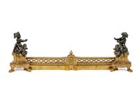 A Pair of Louis XVI Style Parcel-Gilt and Patinated Bronze Chenets and Fender