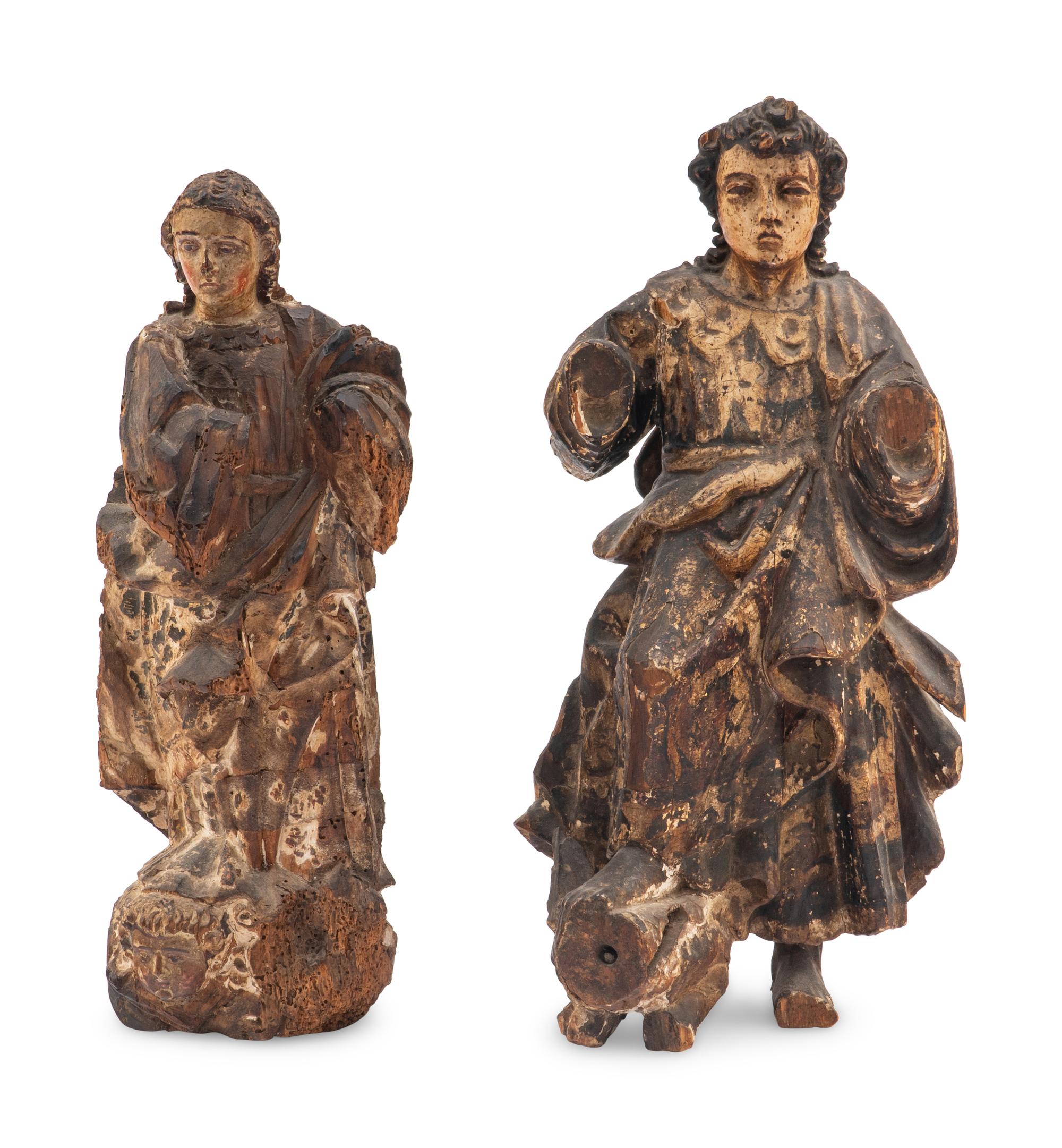 A Pair of Continental Carved and Polychrome Decorated Santo Figures