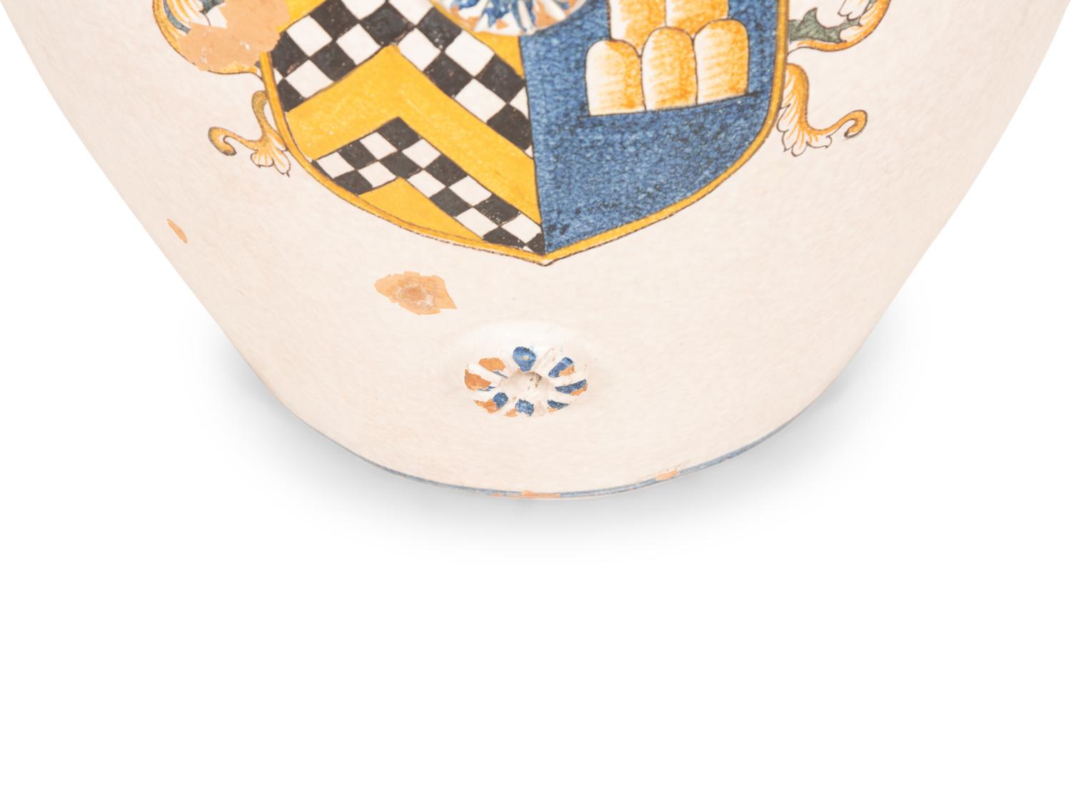 An Italian Glazed Terracotta Olive Jar with Painted Armorial