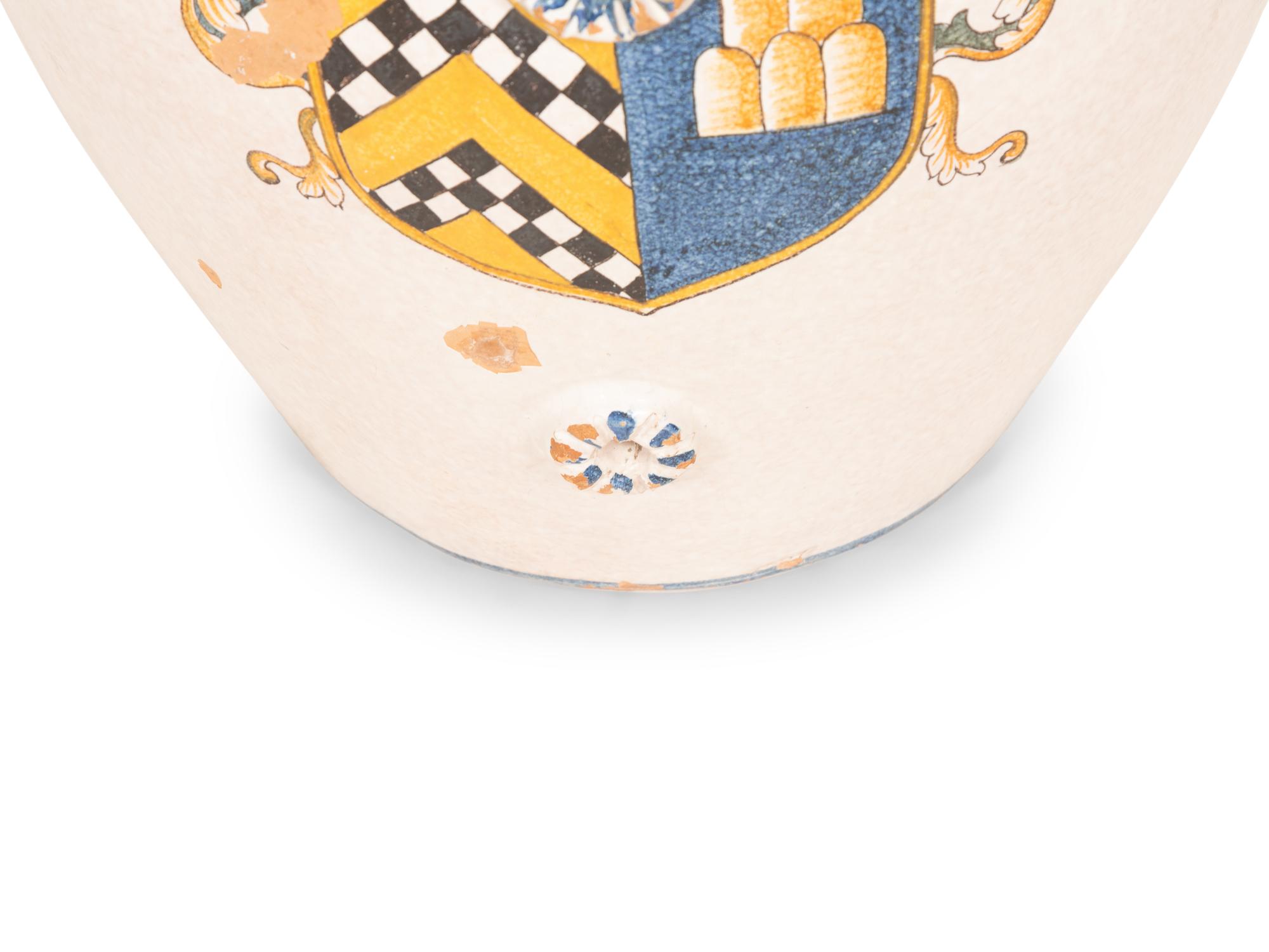 An Italian Glazed Terracotta Olive Jar with Painted Armorial