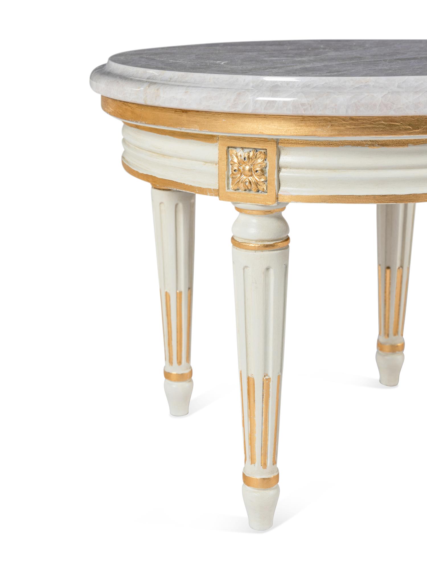 A Louis XVI Style Painted and Parcel Gilt Quartz-Top Low Table