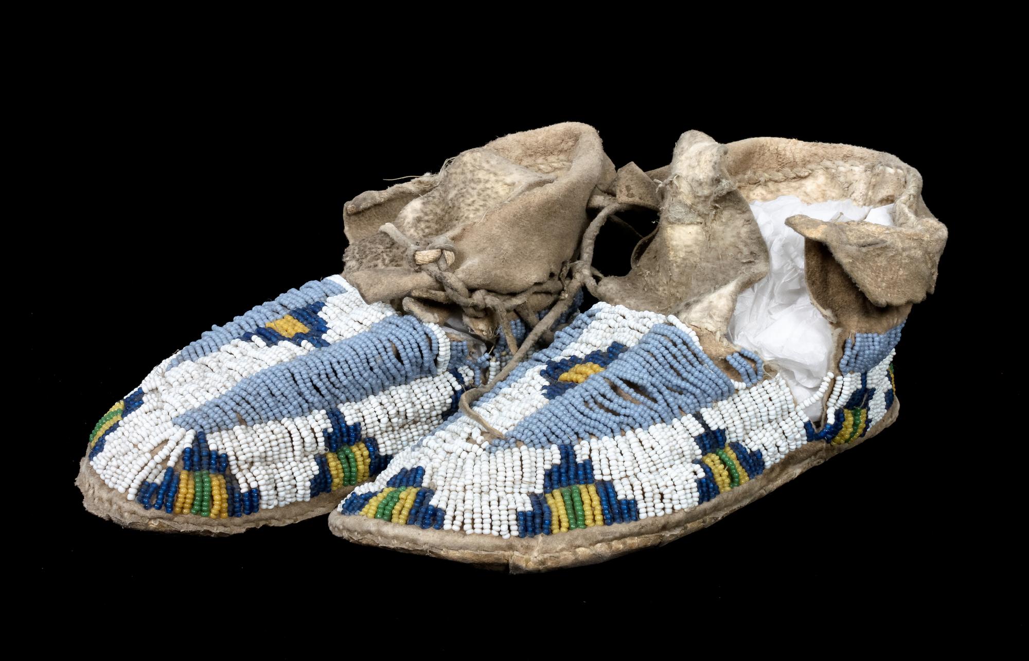 A Pair of Sioux Beaded Moccasins Length 7 1/2 inches.