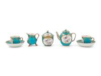 A Sèvres Painted and Parcel Gilt Porcelain Tea and Cordial Service in a Fitted Kingwood and Parquetry Traveling Case