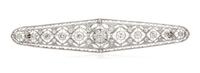 An Edwardian Platinum, White Gold and Diamond Bar Brooch, 4.60 dwts.