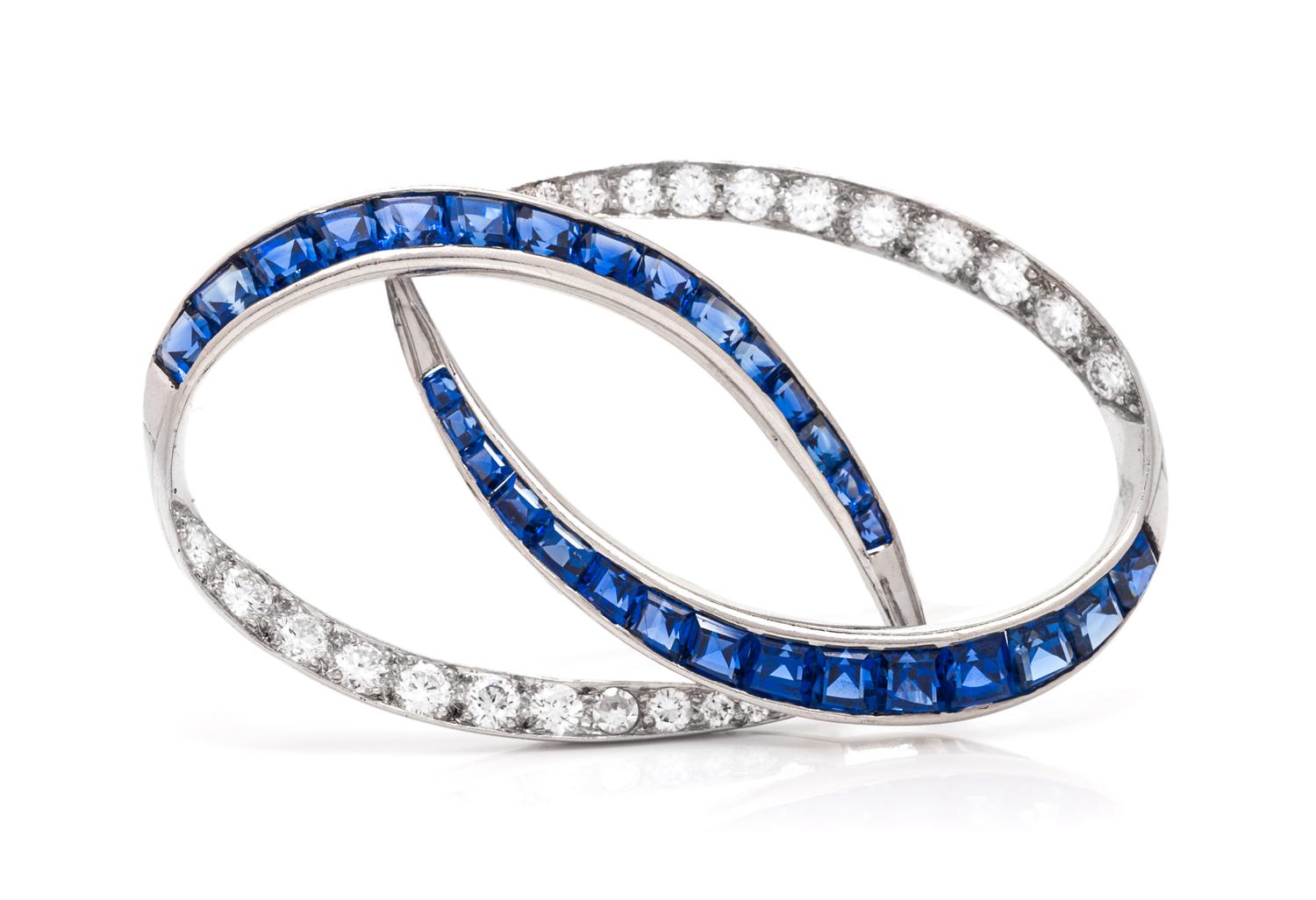 A Platinum, Diamond and Sapphire Brooch, Oscar Heyman Brothers, 6.00 dwts.