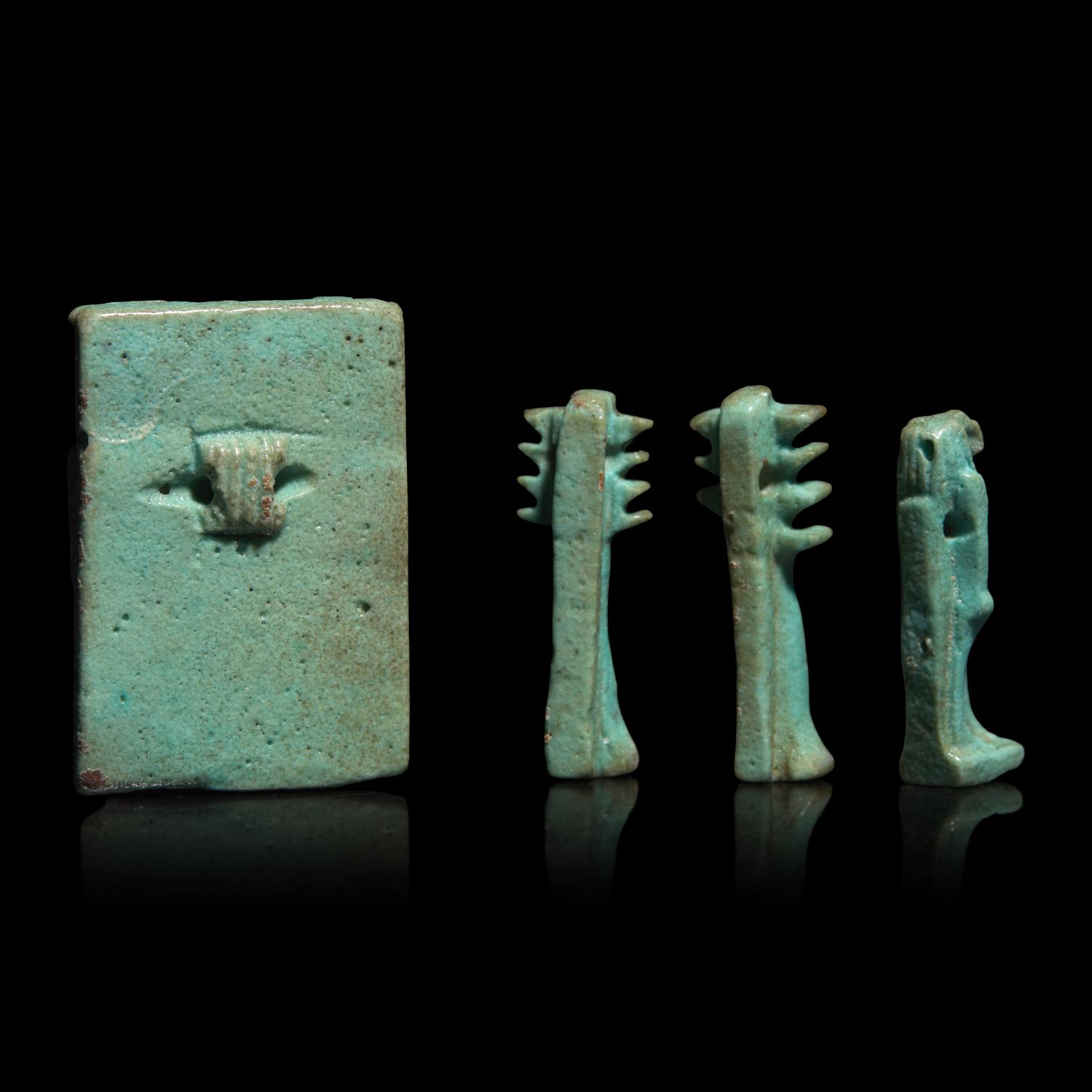 An Egyptian Faience Amulet with the Osirian Triad, two Djed Pillars, and a Thoth Amulet