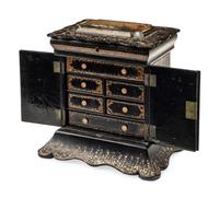 An English Mother-of-Pearl Inlaid Ebonized Cabinet
