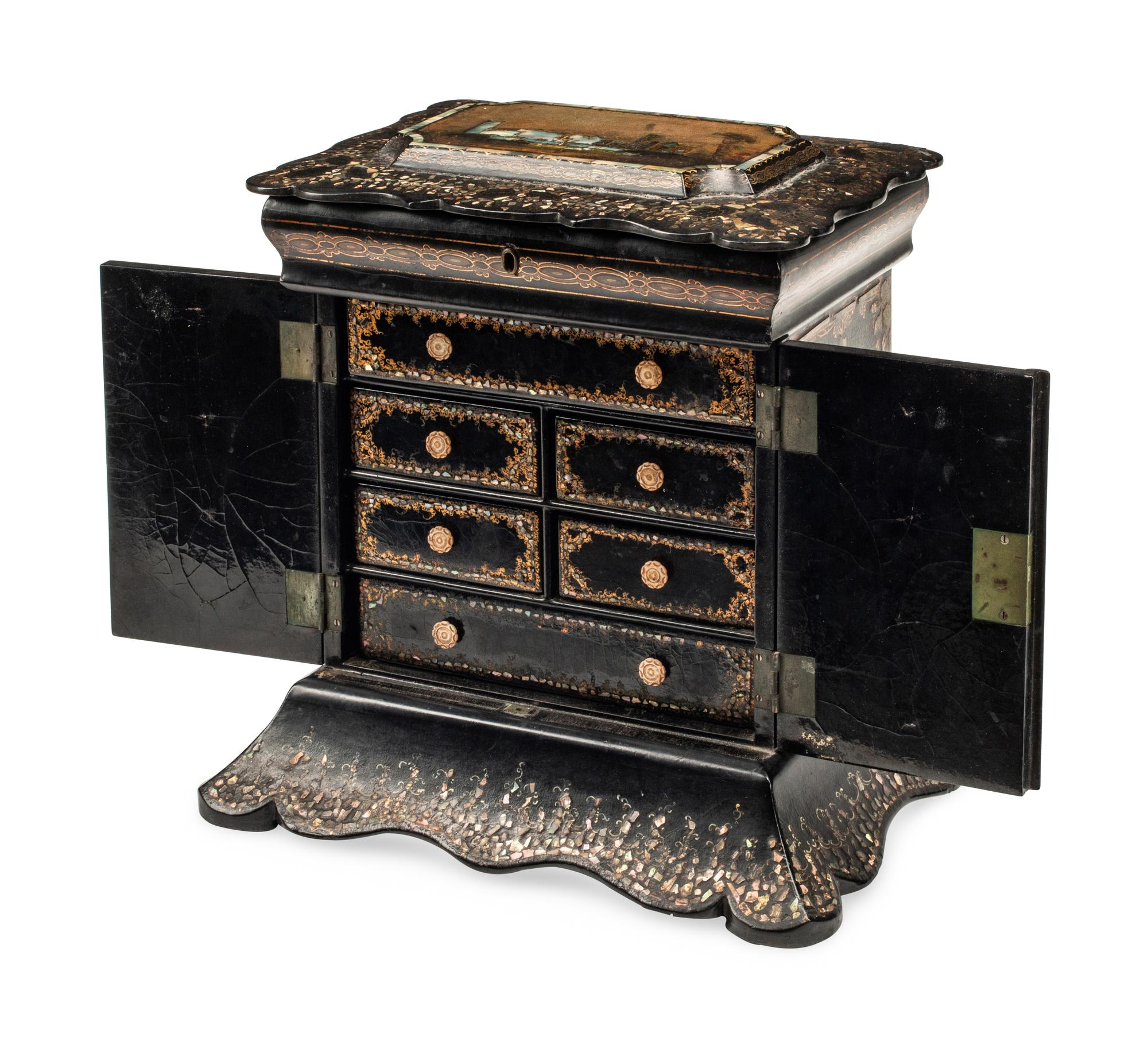 An English Mother-of-Pearl Inlaid Ebonized Cabinet