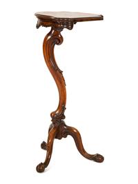 An Italian Rococo Carved Walnut Tripod Stand