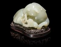A Chinese Celadon Jade Figure of a Recumbent Ram
