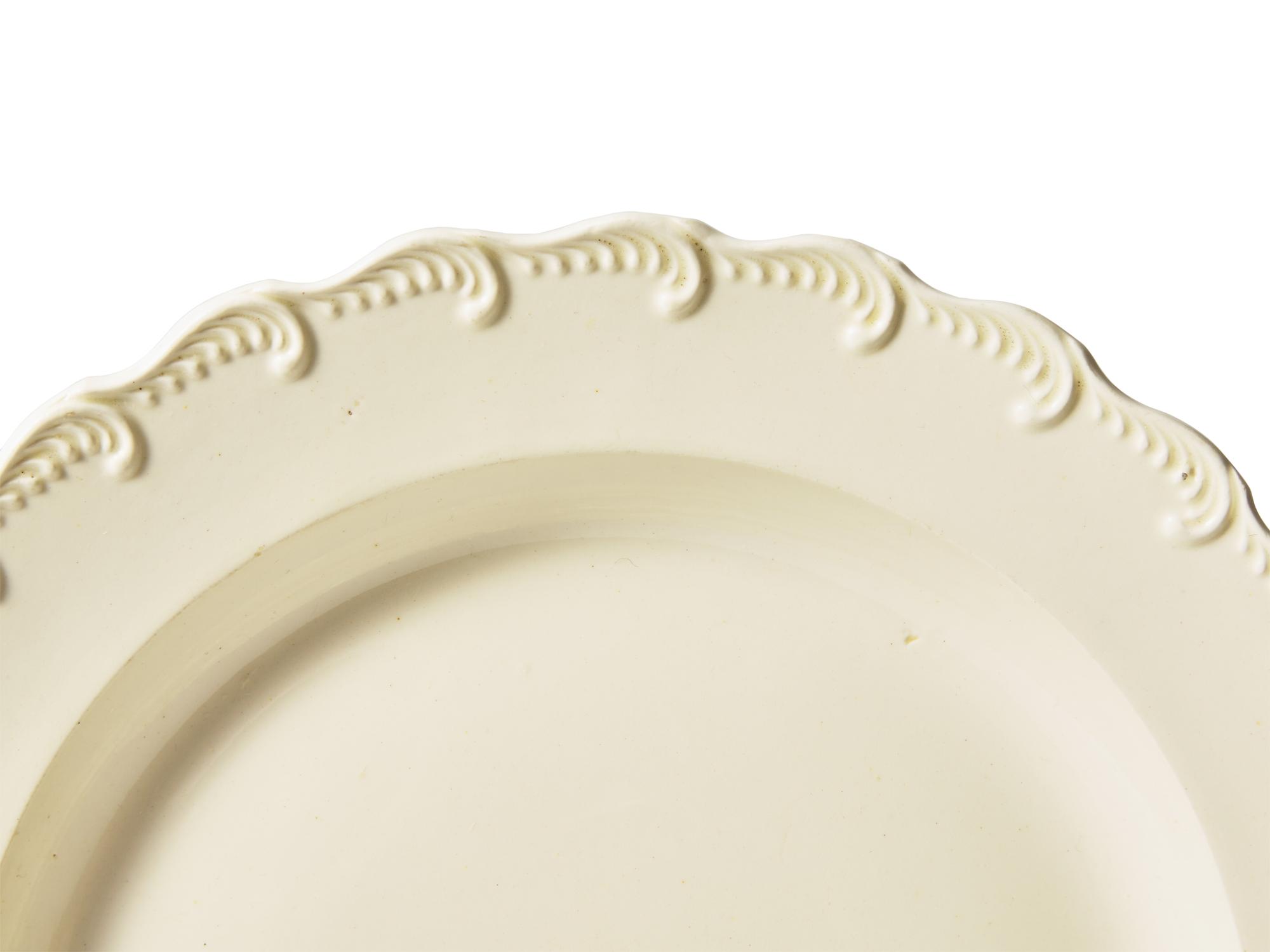 A Set of Ten Scalloped Creamware Dinner Plates