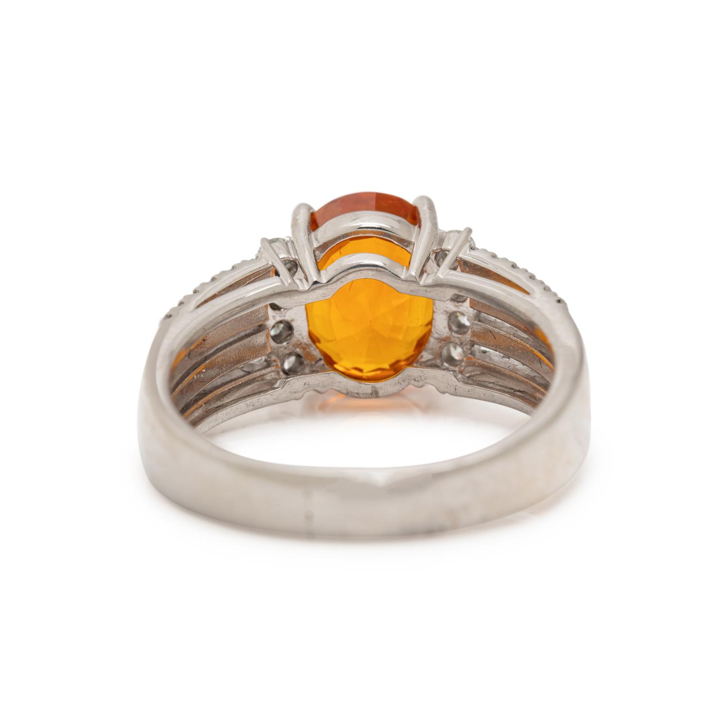 ORANGE SAPPHIRE AND DIAMOND RING
