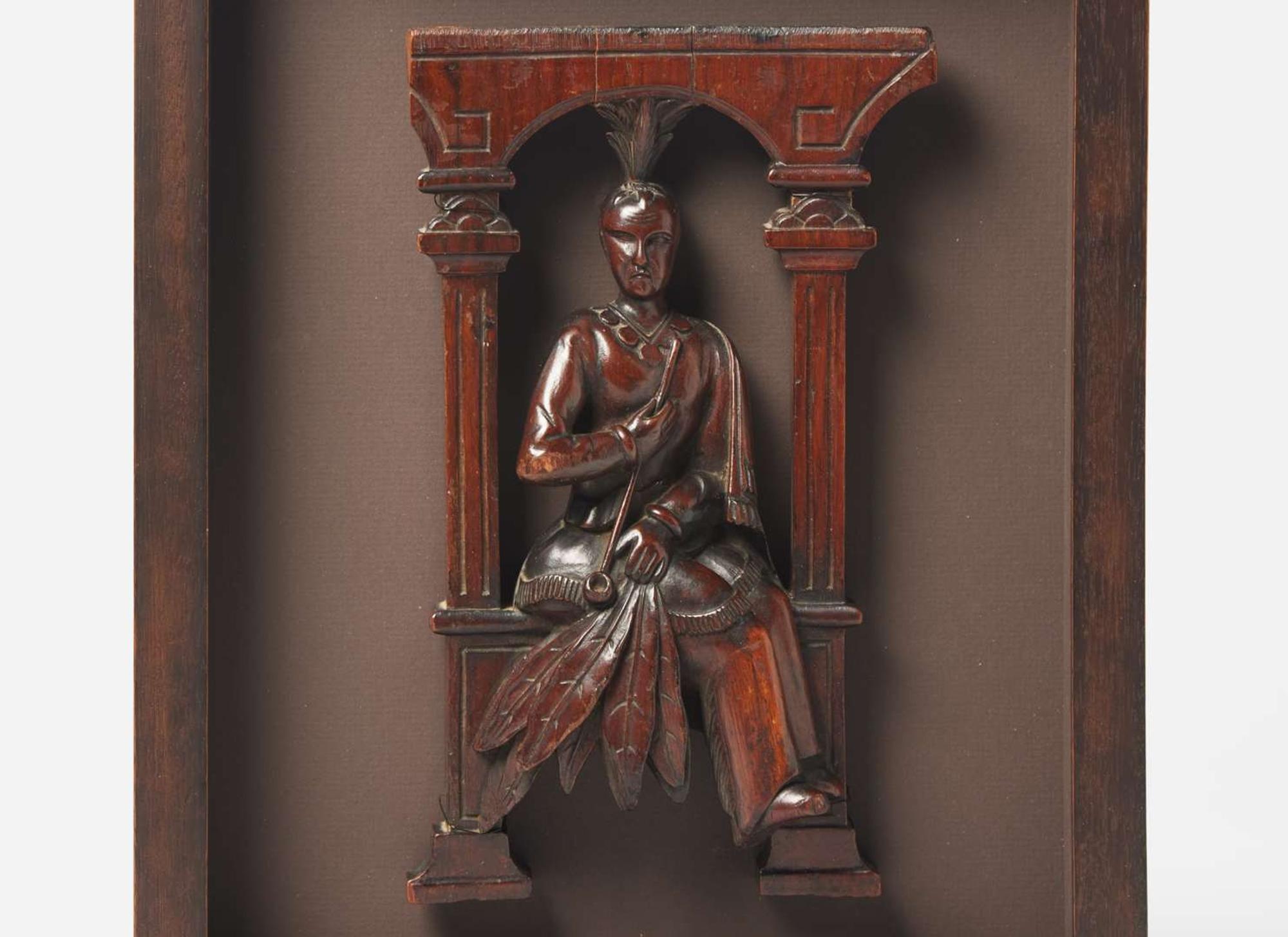 A carved architectural element of an American Indian with a Pipe, South Carolina, 19th century