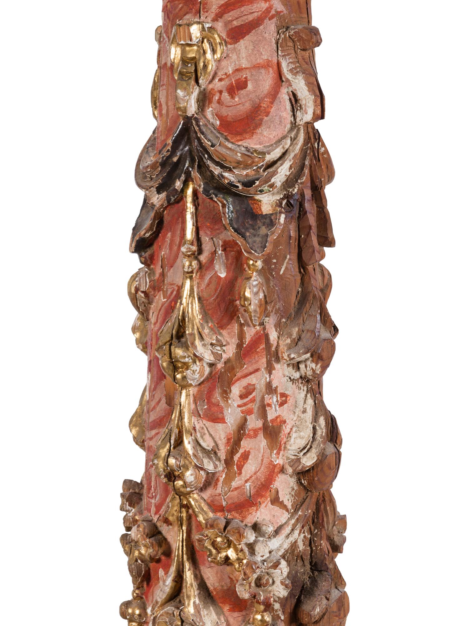 A Pair of Spanish Painted and Parcel Gilt Solomonic Columns