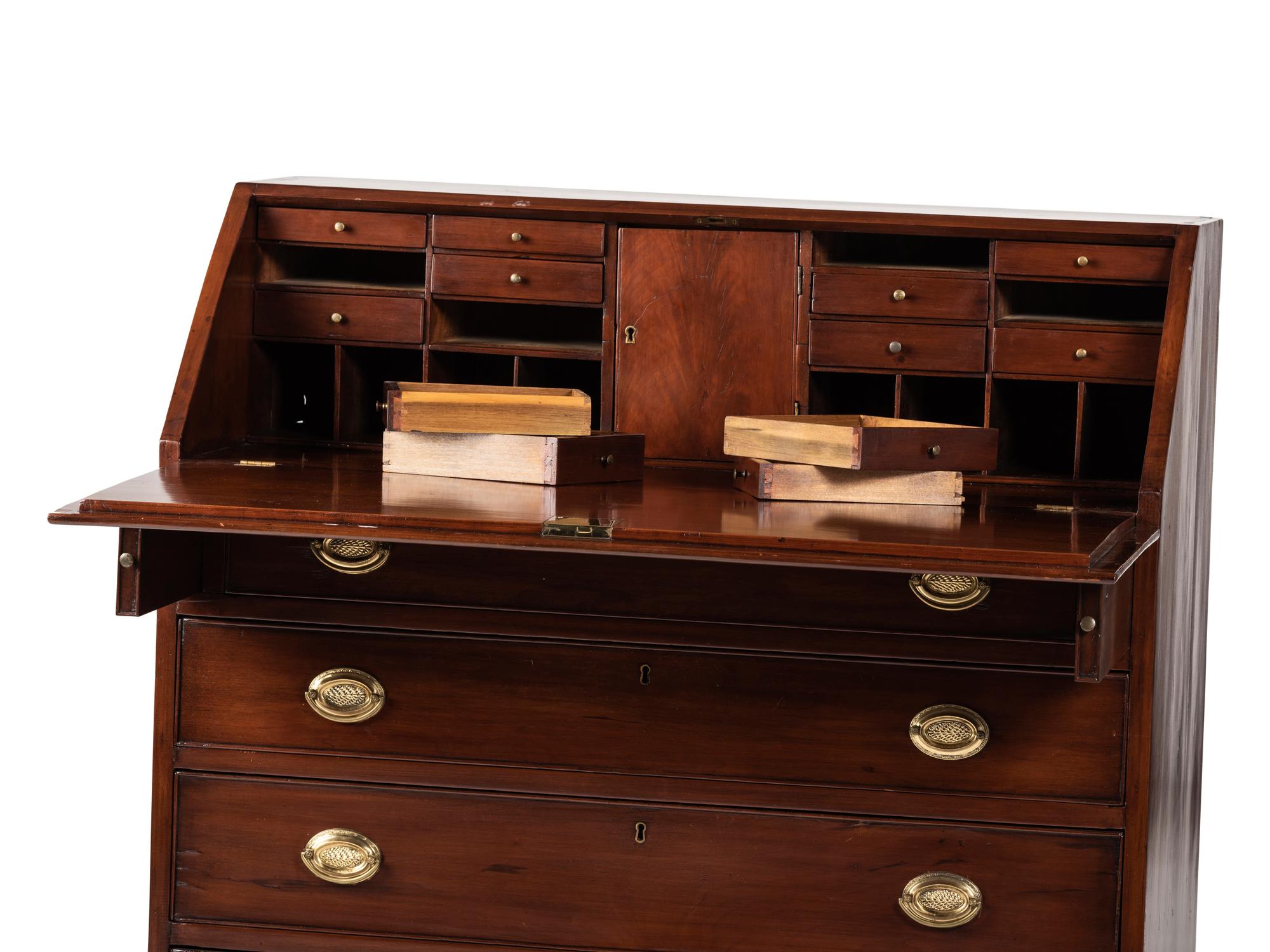 A Chippendale Cherrywood Slant-Front Chest of Drawers