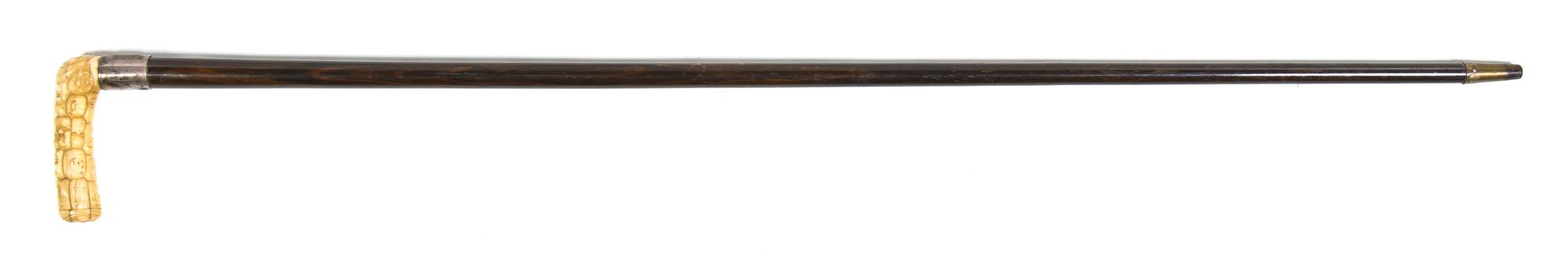 A Japanese Carved Ivory Cane Handle, Height overall 36 3/4 x width of handle 4 1/8 inches.