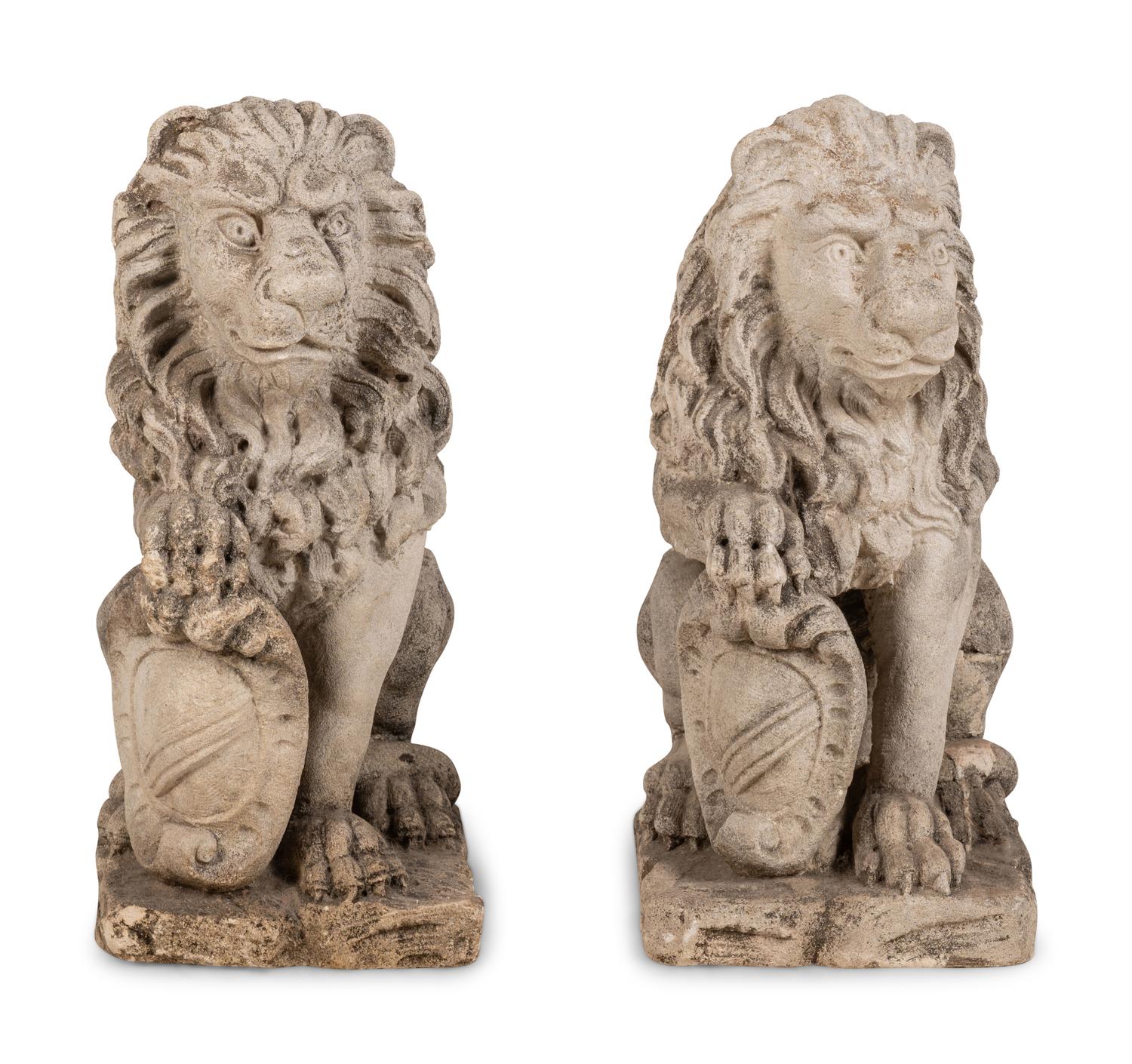 A Pair of Cast Stone Lion Figures