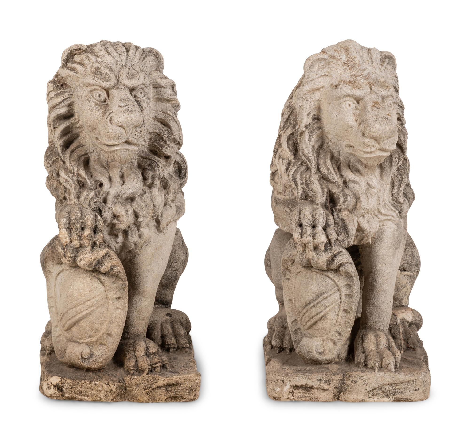 A Pair of Cast Stone Lion Figures