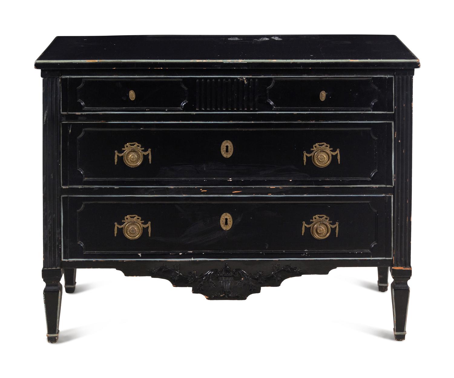 An Italian Gilt Metal Mounted Ebonized Chest of Drawers