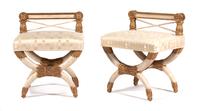 A Pair of Empire Style Parcel-Gilt and Cream-Painted Stools