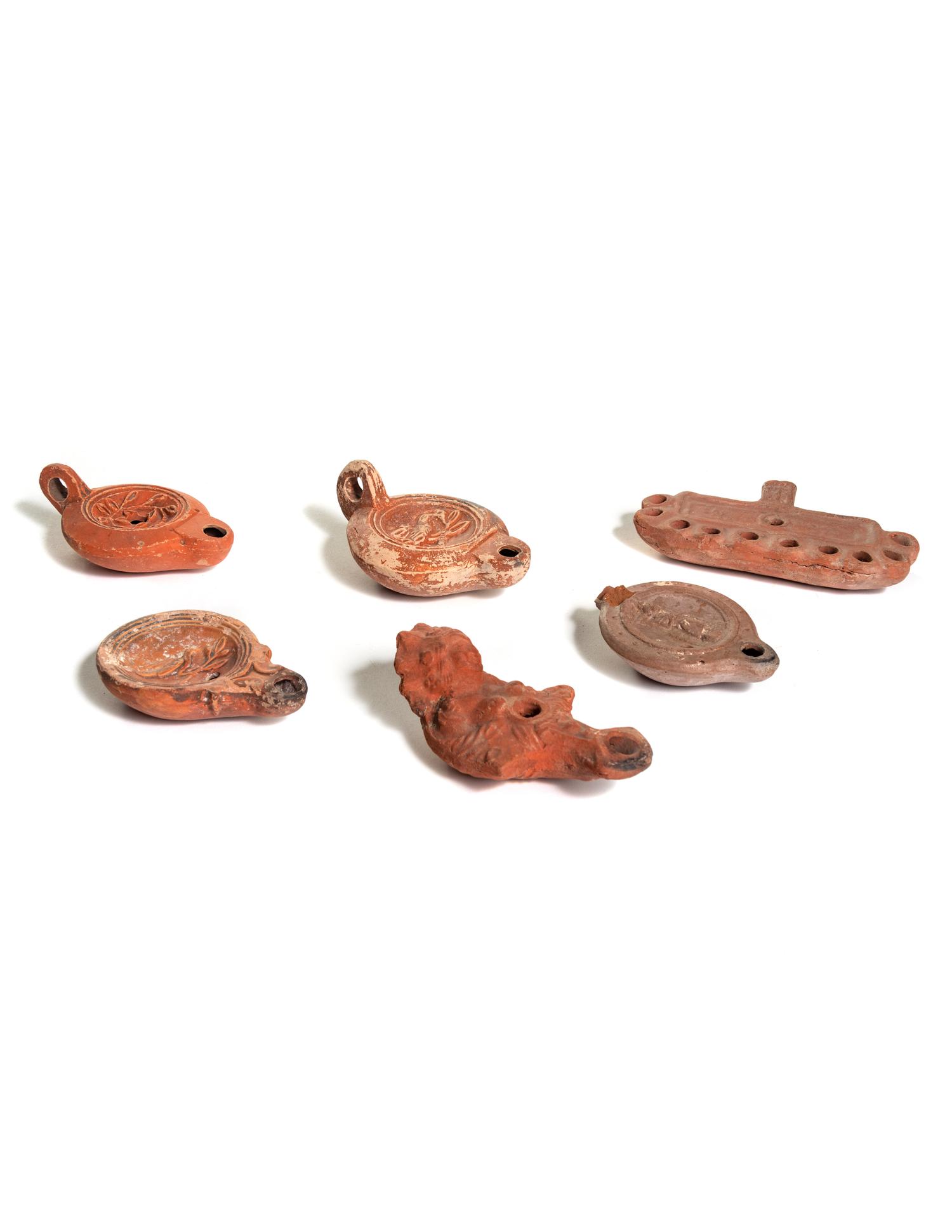 Six Roman Molded Terra Cotta Oil Lamps