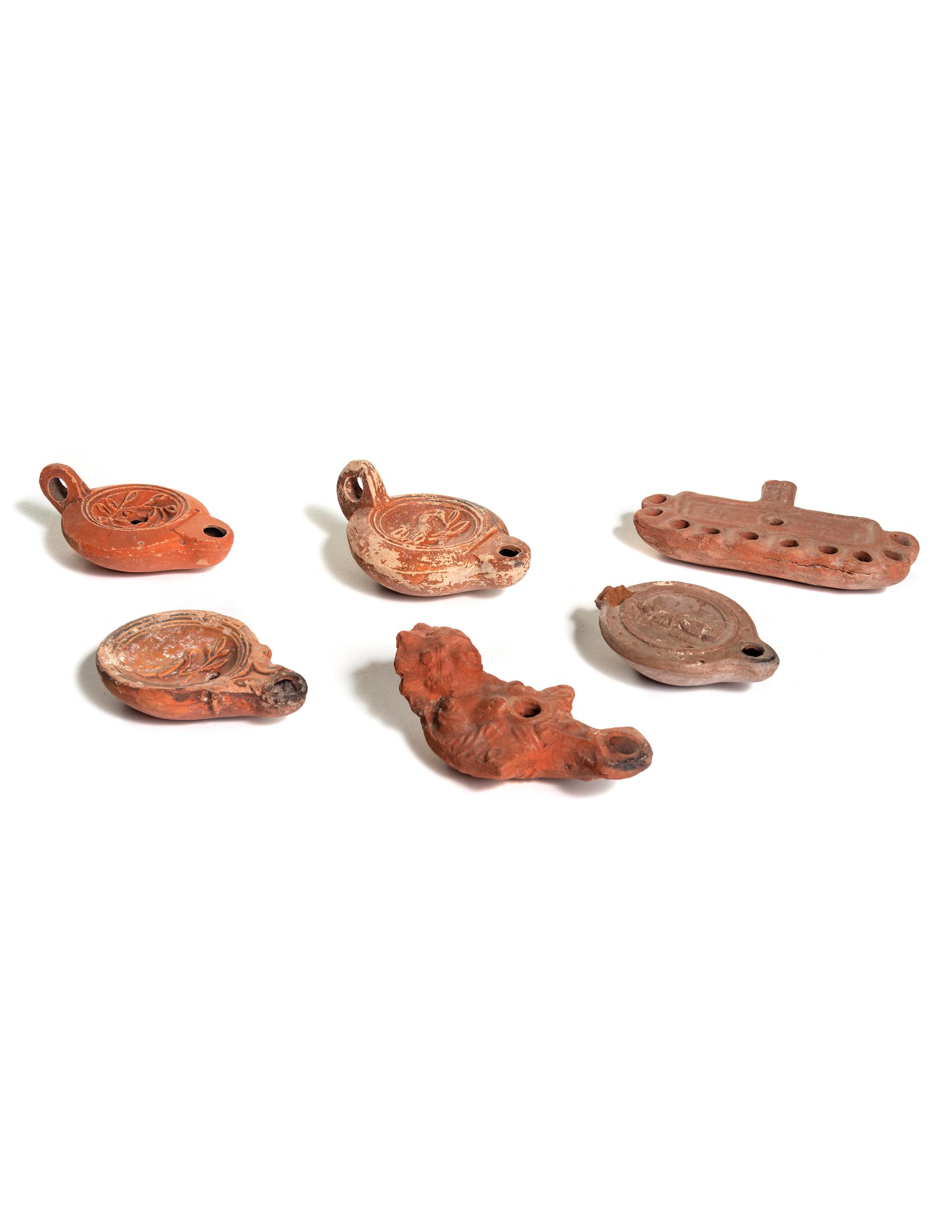 Six Roman Molded Terra Cotta Oil Lamps