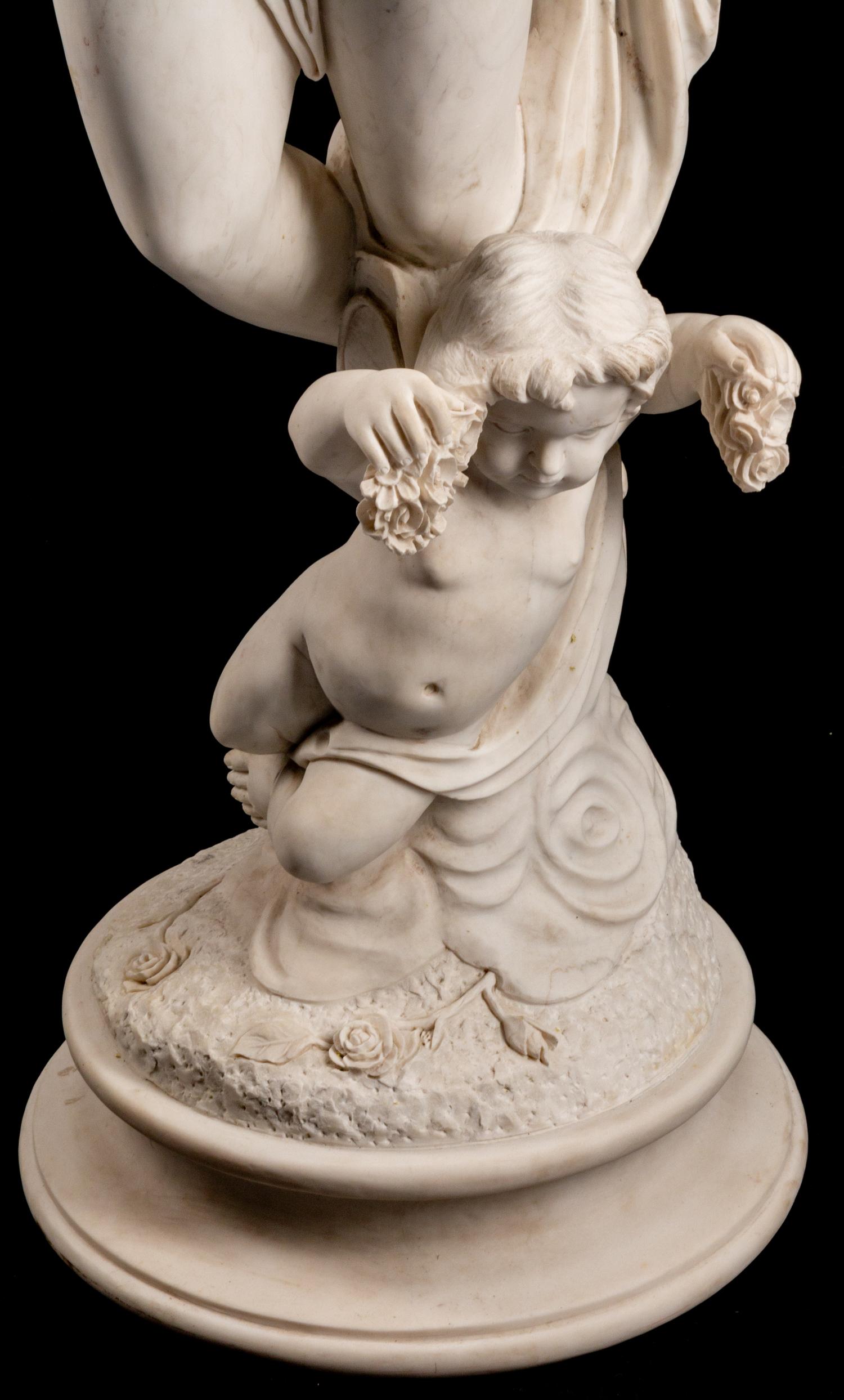 An Italian Marble Figure of Flora and an Infant Attendant