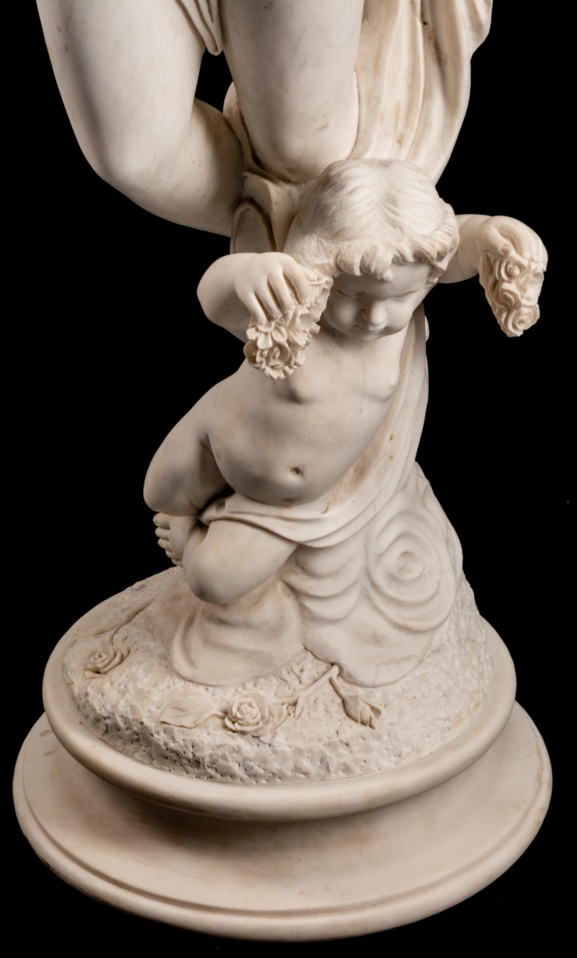 An Italian Marble Figure of Flora and an Infant Attendant