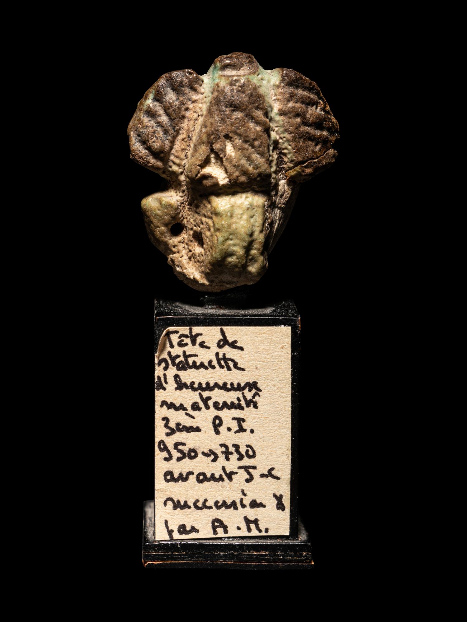 An Egyptian Faience Head of a Concubine