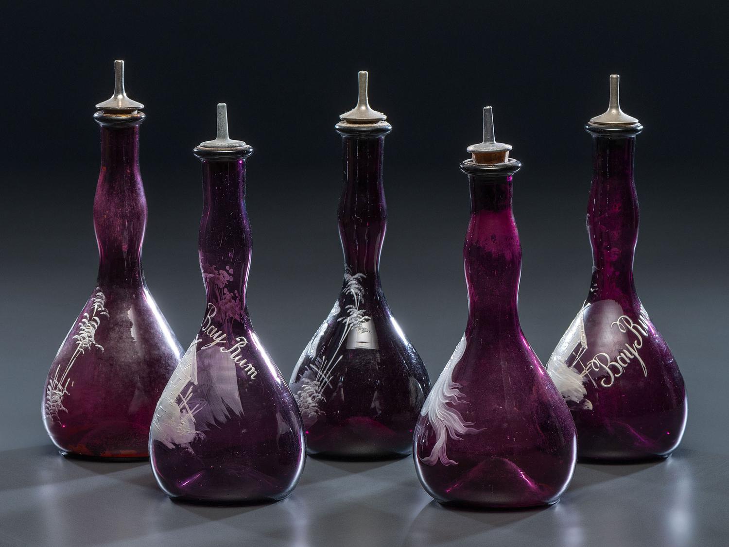Five 'Mary Gregory' Enameled Amethyst Barber Bottles