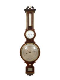 A Regency Crossbanded Mahogany Repeating Clock and Barometer