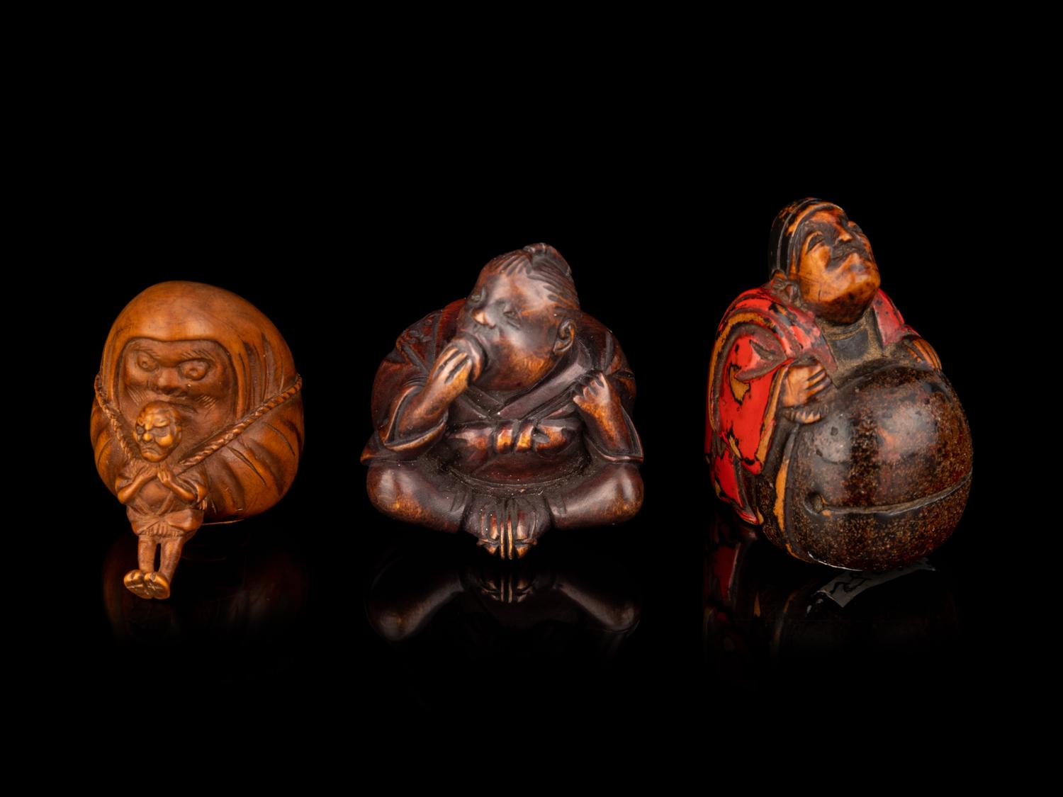 Three Japanese Carved Boxwood Figural-Form Netsuke