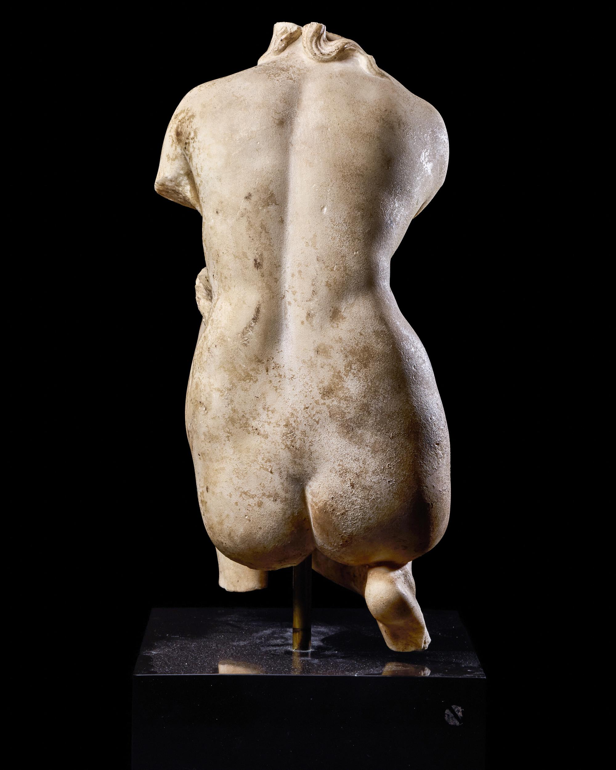 A Roman Marble Crouching Venus