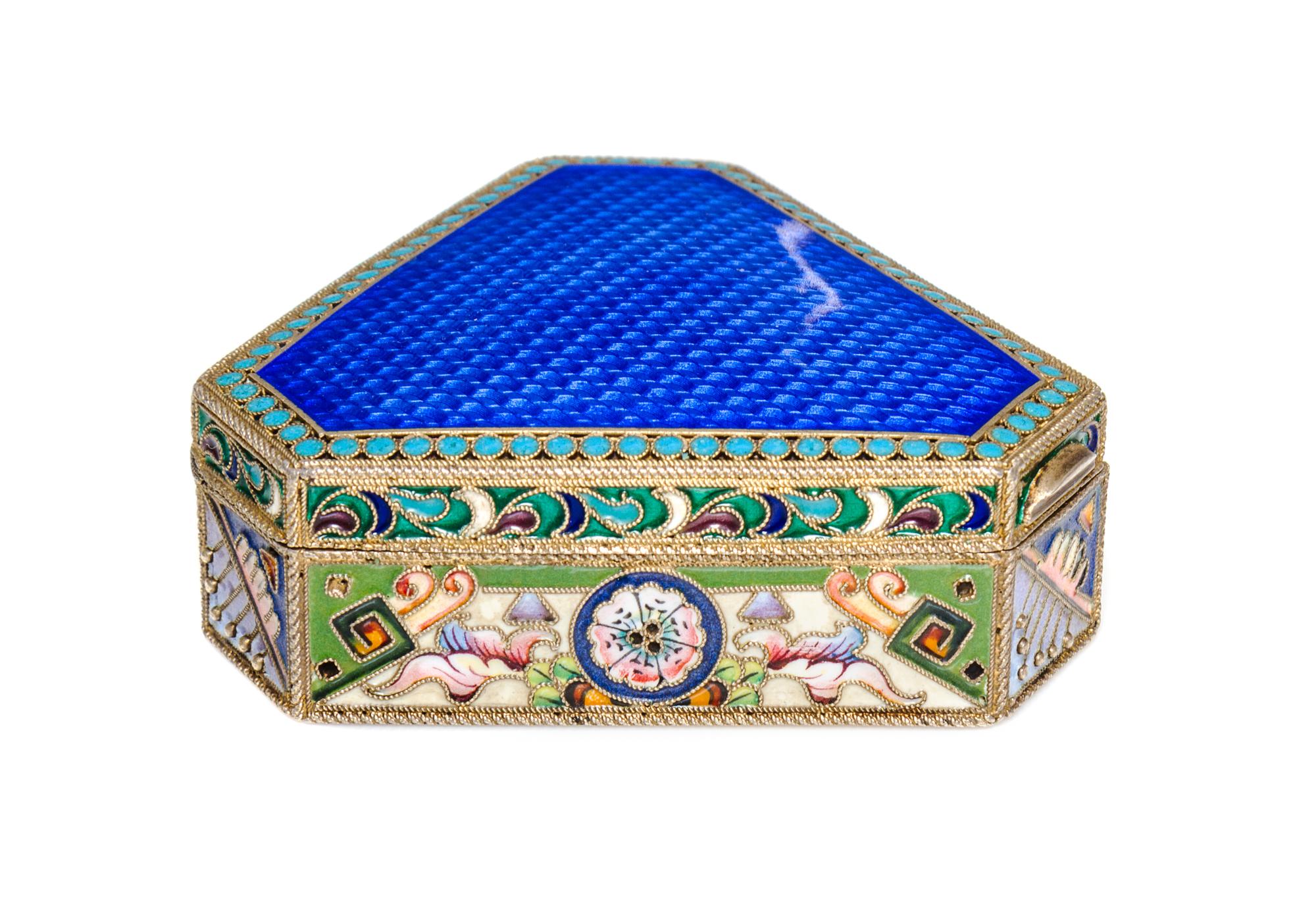 A Russian Jeweled Guilloche Enamel and Silver Box, 20th Artel, Moscow, 1908-1926, of triangular form with canted corners.