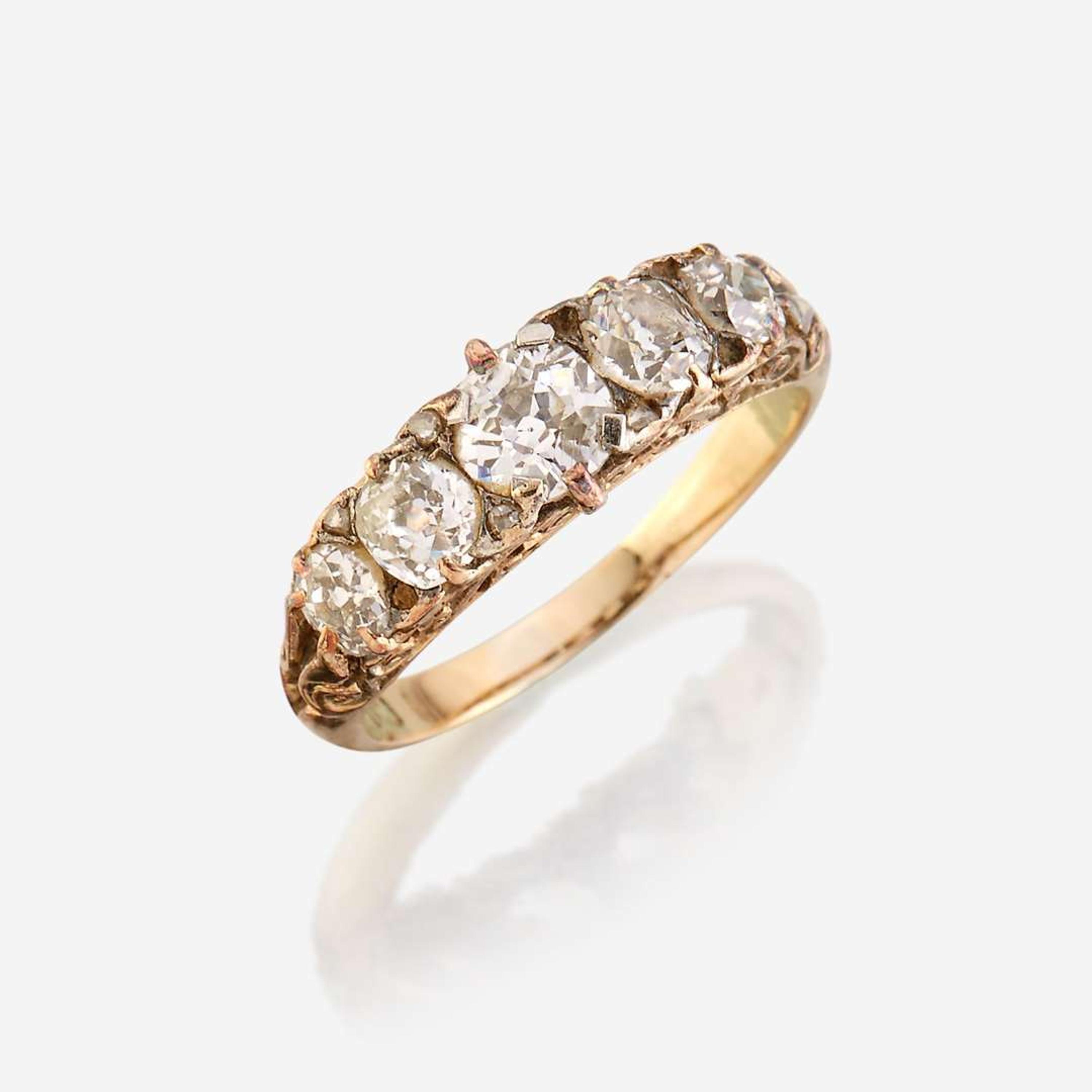 An antique diamond and eighteen karat gold ring