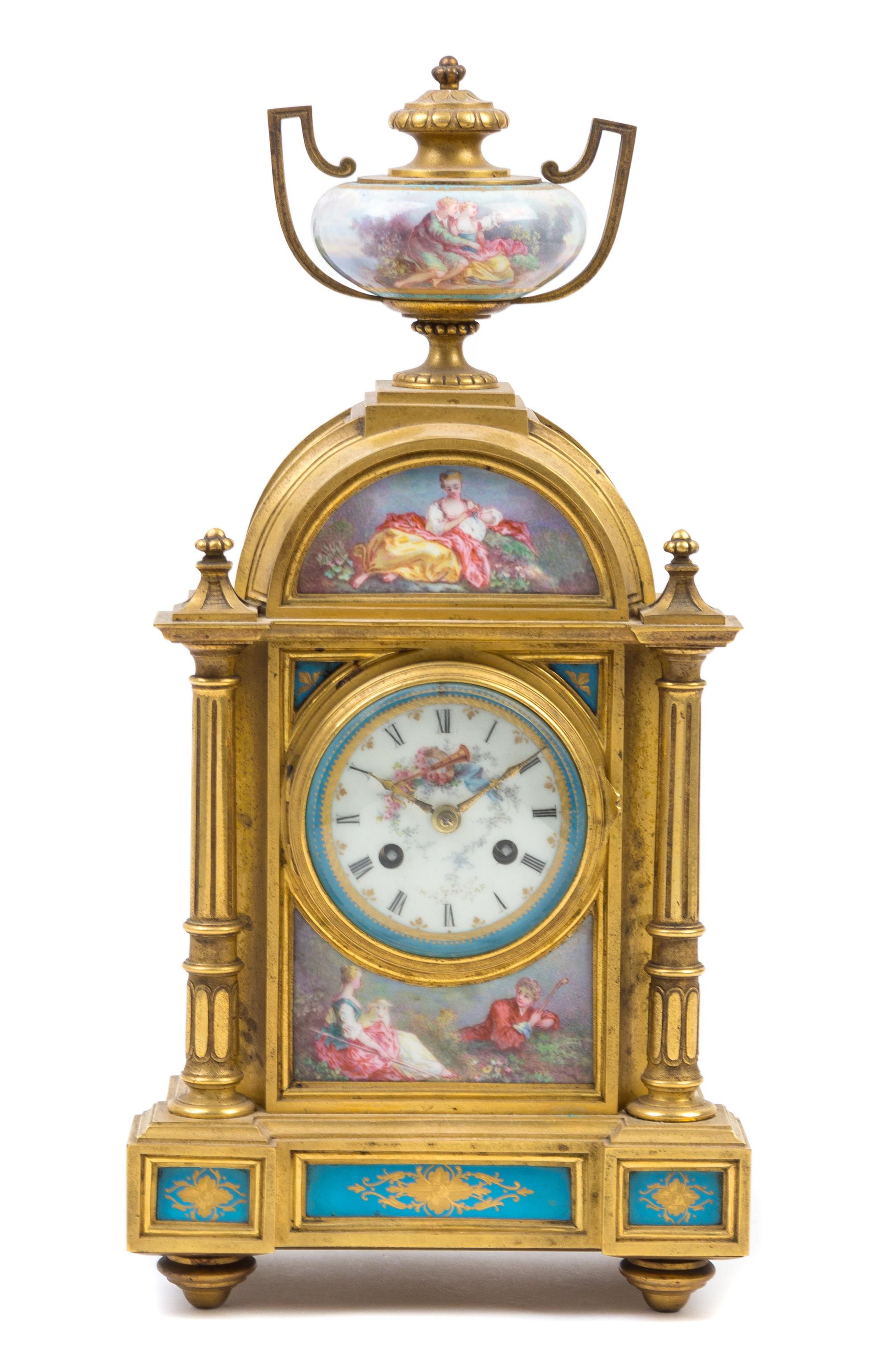 A Louis XVI Style Porcelain Mounted Gilt Bronze Mantle Clock Height 15 inches. — MOVEMENT BY RAINGO FRERES, 19TH CENTURY