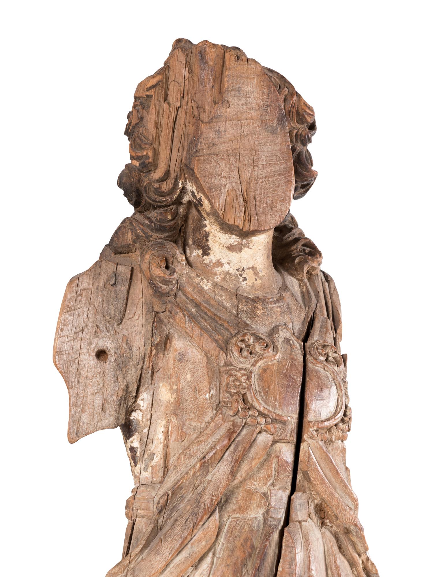 A Continental Carved Angel Figure