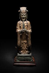 A Pair of Chinese Gilt Decorated Bronze Figures of Standing Officials