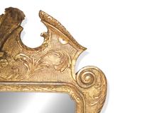 A George I giltwood and gesso looking glass, early 18th century