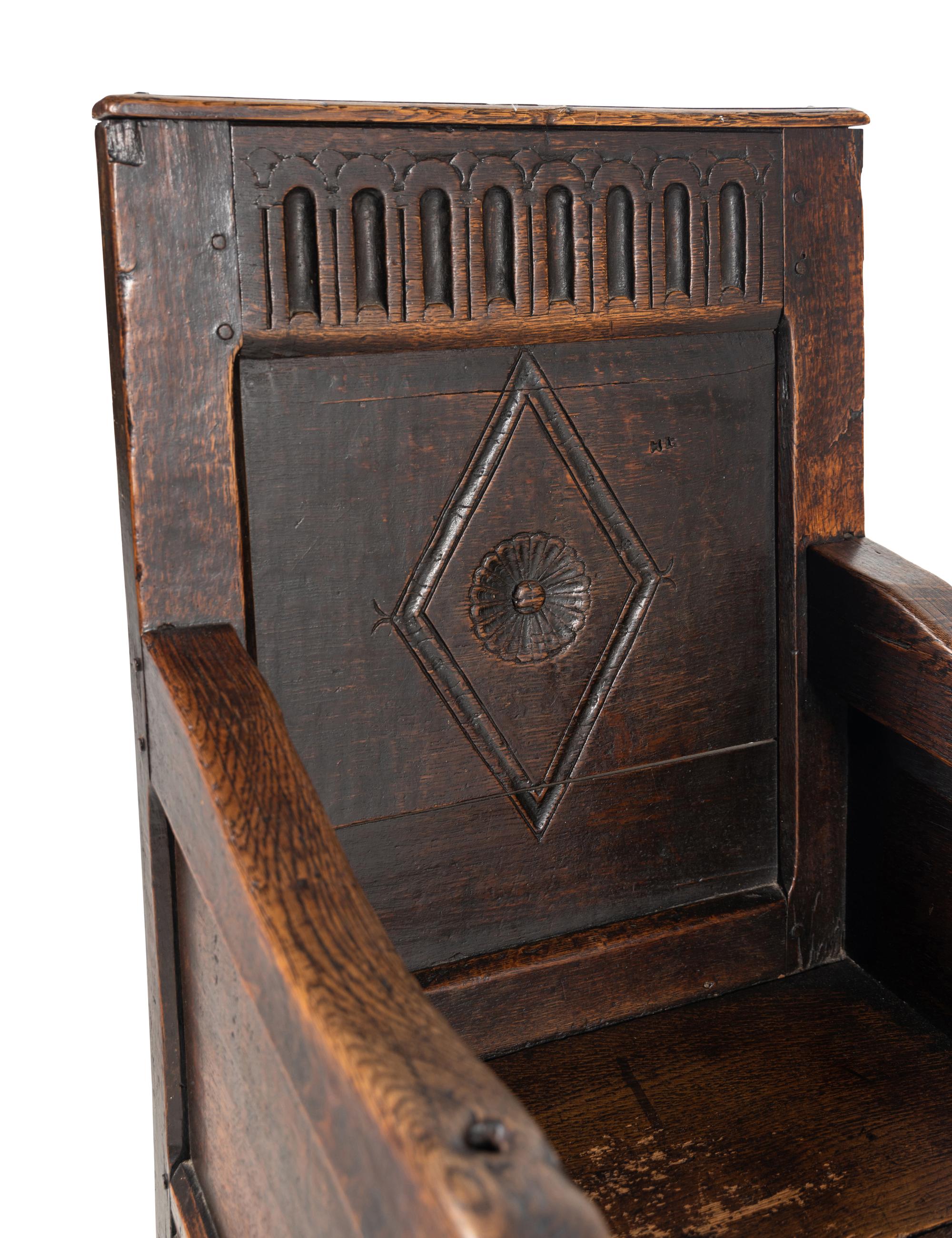 A Charles II Oak Armchair