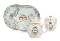 A Pair of Chinese Export Armorial Dishes, a Teapot and Sugar Basin Diameter of dish 8 7/8 inches. — 18TH CENTURY