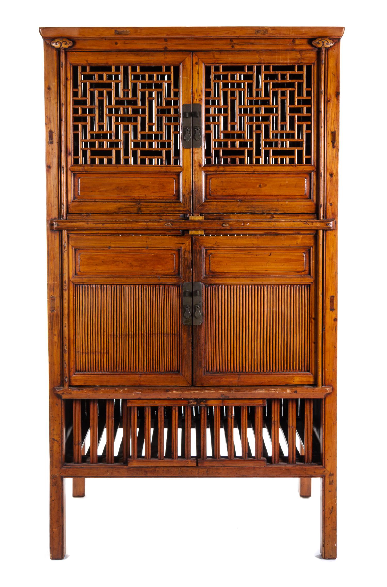 A Chinese Softwood Cabinet Height 77 1/2 x width 43 x depth 28 3/8 inches.