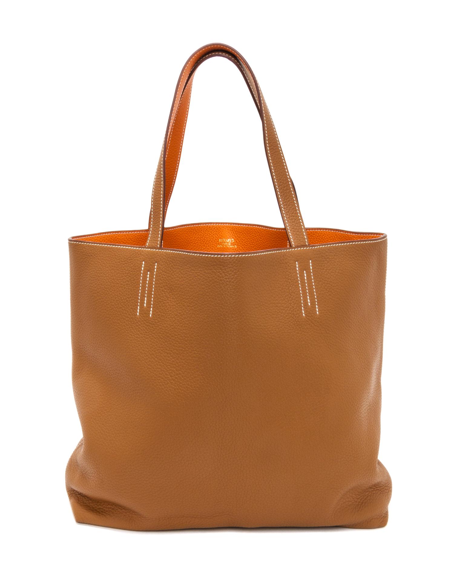 An Hermes Orange/Gold 45cm Taurillon Clemence Double Sens Tote, 17.5" x 15.5" x 5".