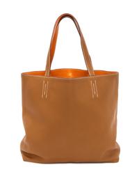 An Hermes Orange/Gold 45cm Taurillon Clemence Double Sens Tote, 17.5" x 15.5" x 5".