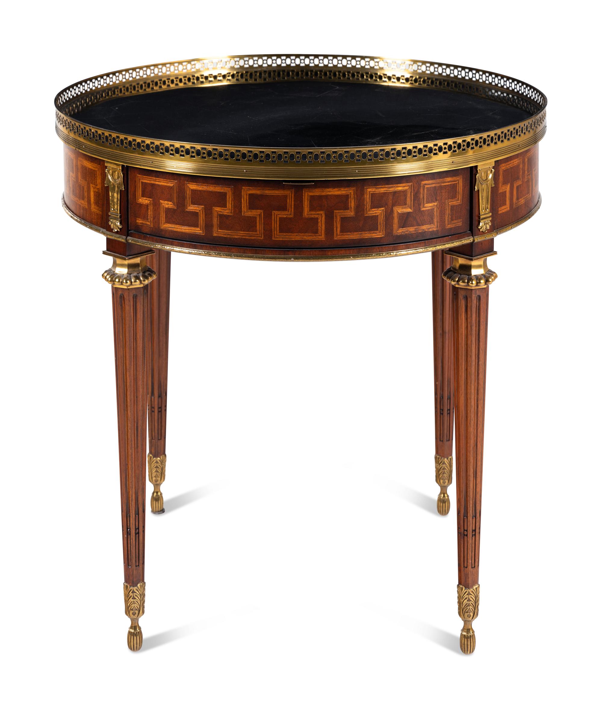 A Louis XVI Style Gilt Metal Mounted Marble-Top Mahogany Guéridon