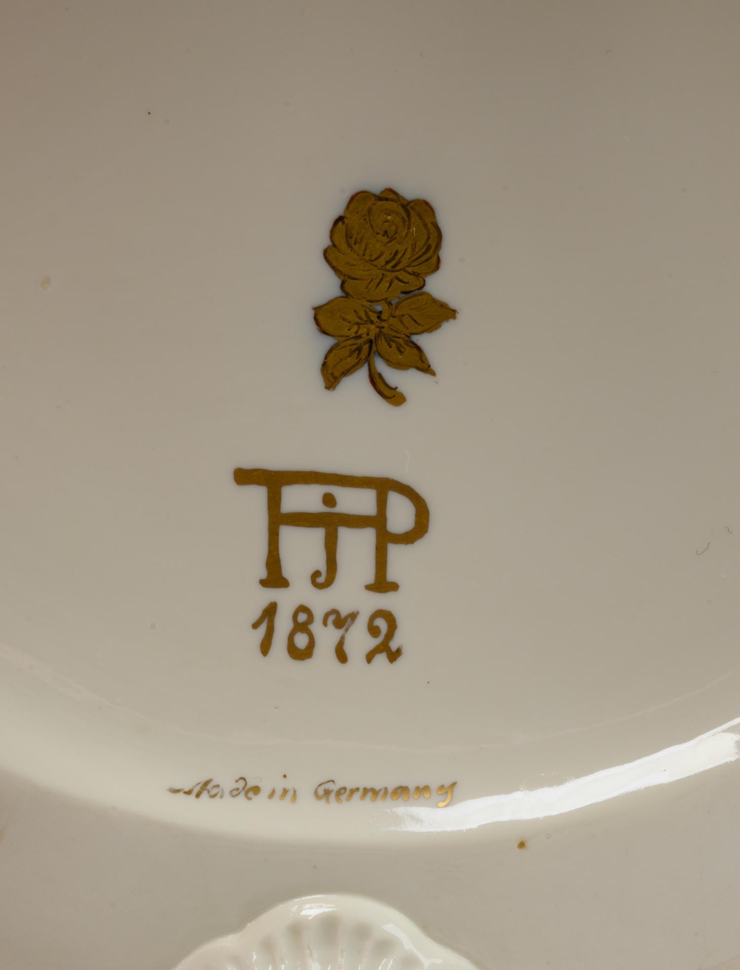 A Pair of German White Glazed Porcelain Candelabra