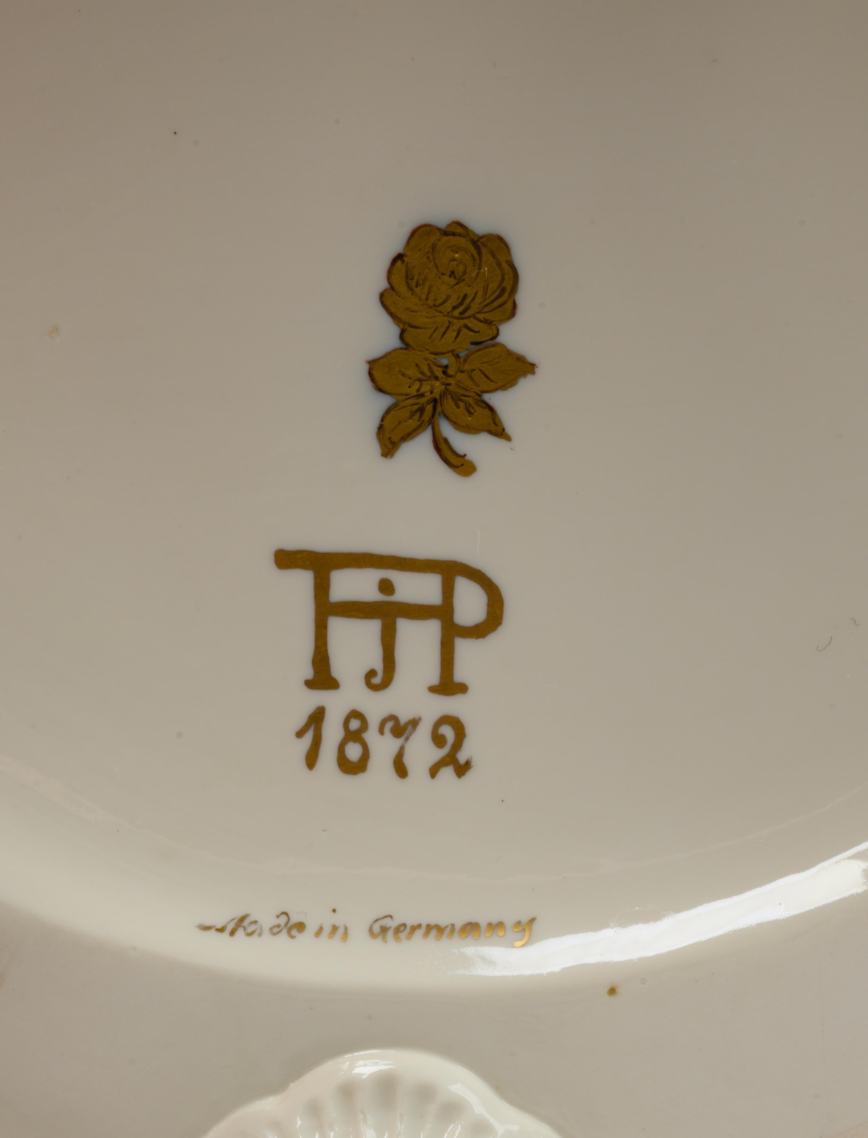A Pair of German White Glazed Porcelain Candelabra
